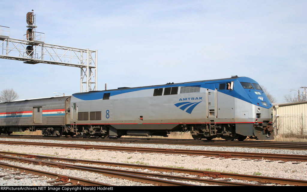 AMTK 8 leads a train at Charlie Baker